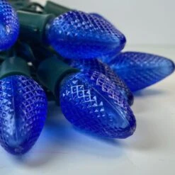 25-light C7 Blue LED Christmas Lights, 8" Spacing Green Wire 13 25-light C7 Blue LED Christmas Lights, 8" Spacing Green Wire -Decorative Lighting Store c7 blue led christmas lights green wire a