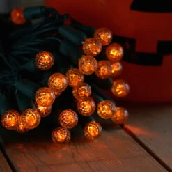 50-light G12 Orange LED Christmas Lights, 4" Spacing Green Wire -Decorative Lighting Store g12 orange led christmas lights halloween 82818