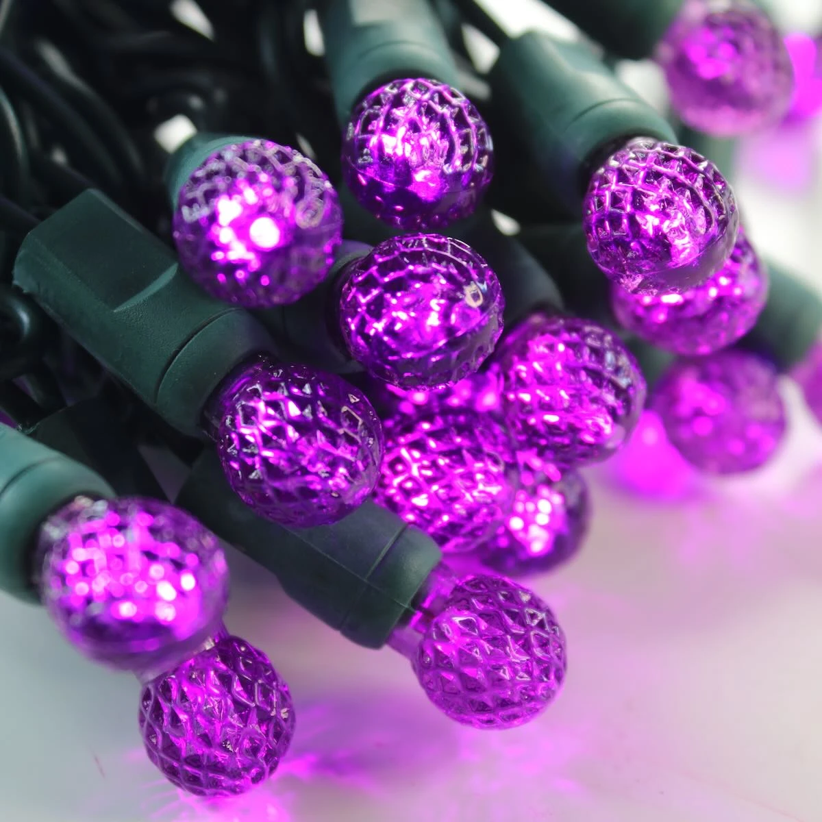 50-light G12 Purple LED Christmas Lights, 4" Spacing Green Wire 3 50-light G12 Purple LED Christmas Lights, 4" Spacing Green Wire