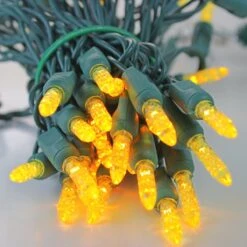 50-light M5 Yellow LED Christmas Lights, 4" Spacing Green Wire -Decorative Lighting Store m5 yellow b led christmas lights green wire a989db2e 652b 40c5 a6ca 330e021547c8
