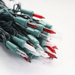 100-bulb Candy Cane (Red Clear Frost) Mini Lights, 4" Spacing, Green Wire -Decorative Lighting Store red clear white frost glass mini lights green wire a