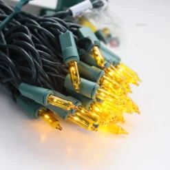 100-bulb Yellow MiniLights, 4" Spacing, Green Wire -Decorative Lighting Store yellow mini lights green wire b